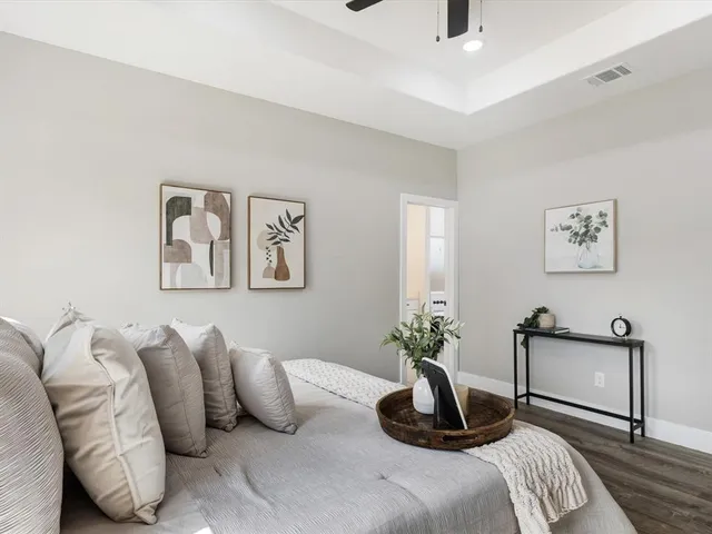 a bedroom with bed and a chair