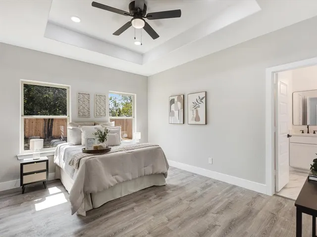a bedroom with a large bed and a window