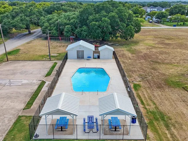 a aerial view of a house with swimming pool
