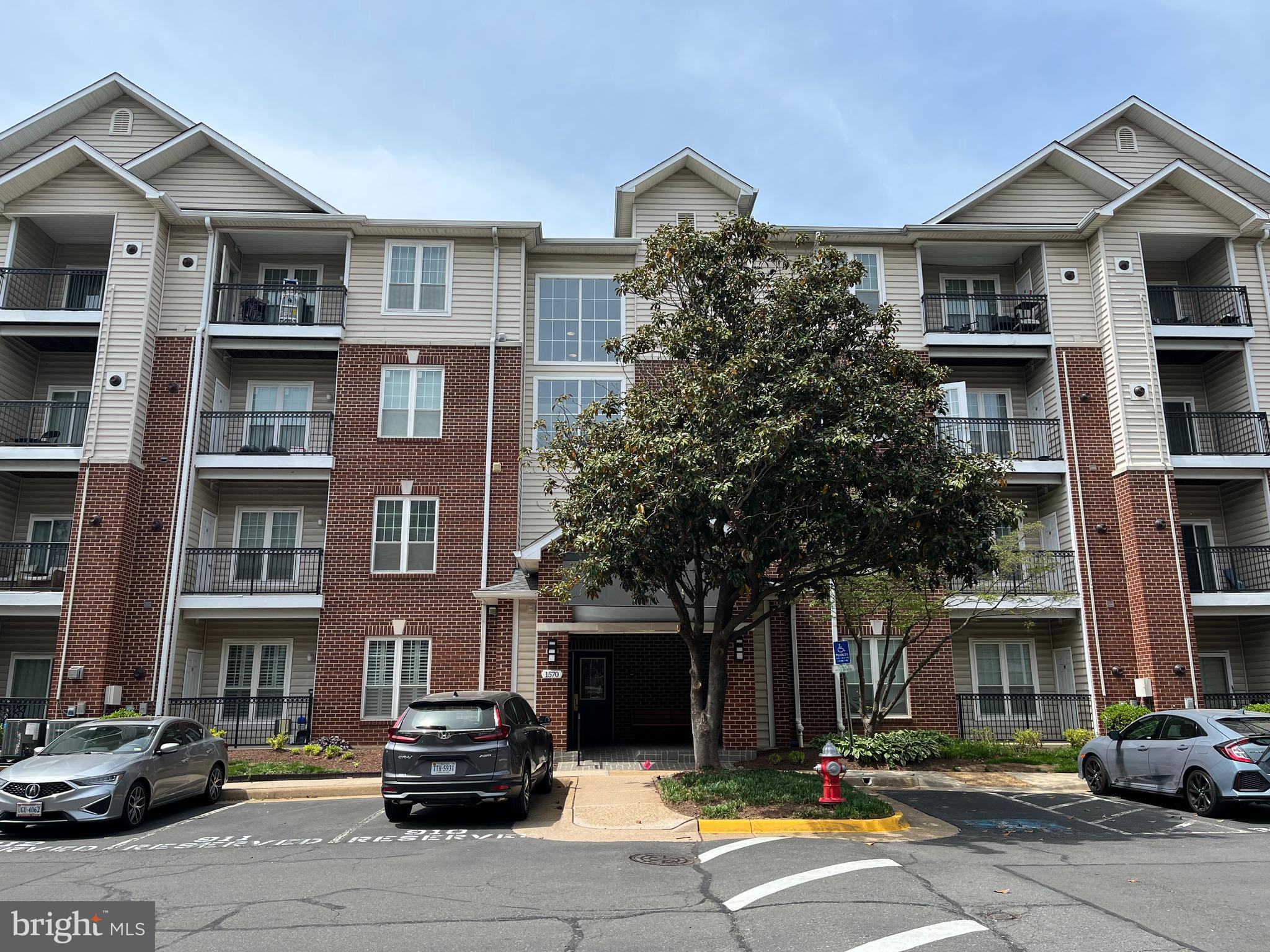 1570 Spring Gate Dr., Unit 7109 McLean, VA 22102 - Photo 1 of 21 a front view of a building with street view