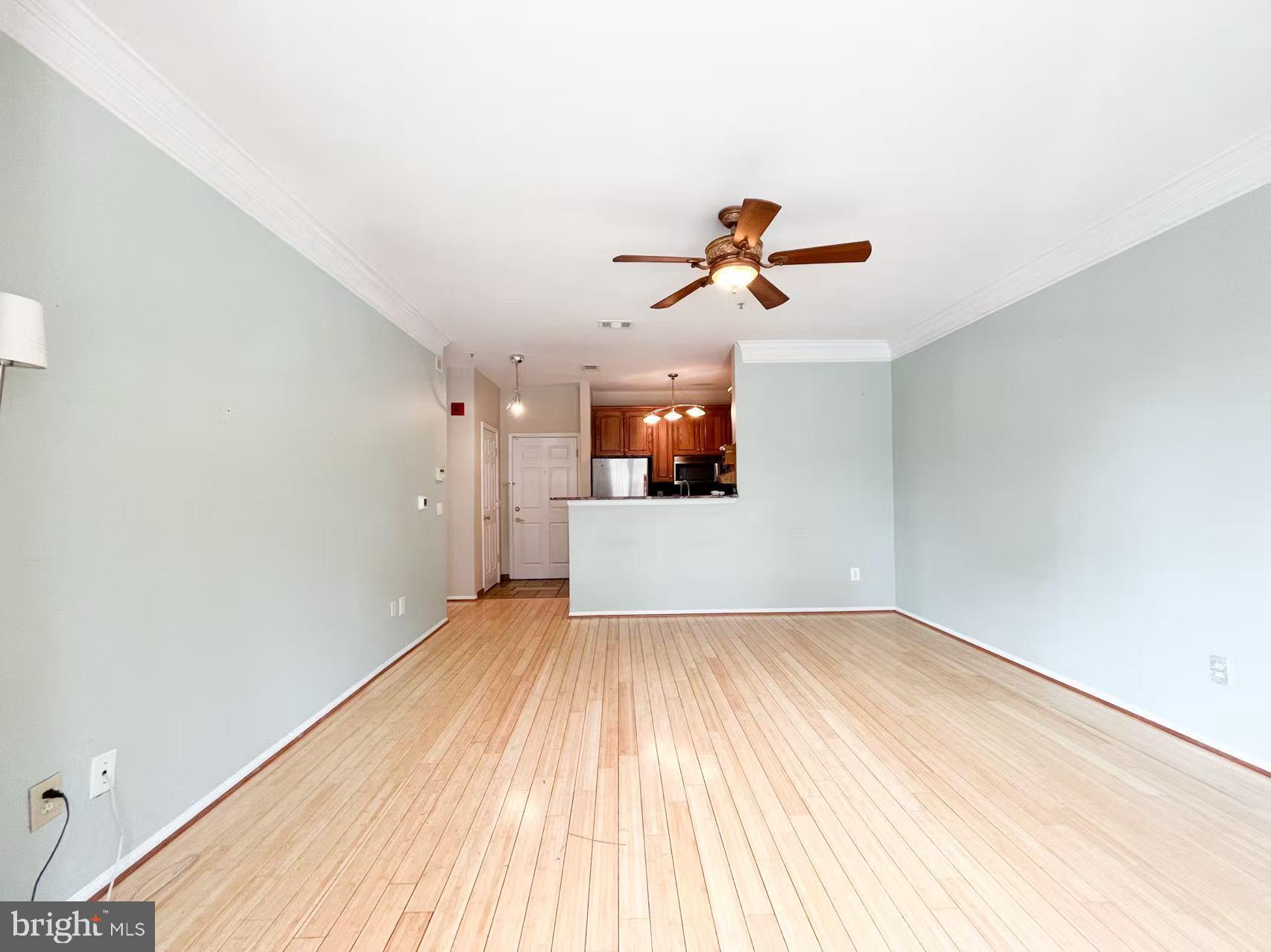 1570 Spring Gate Dr., Unit 7109 McLean, VA 22102 - Photo 12 of 21 wooden floor in an empty room with a window