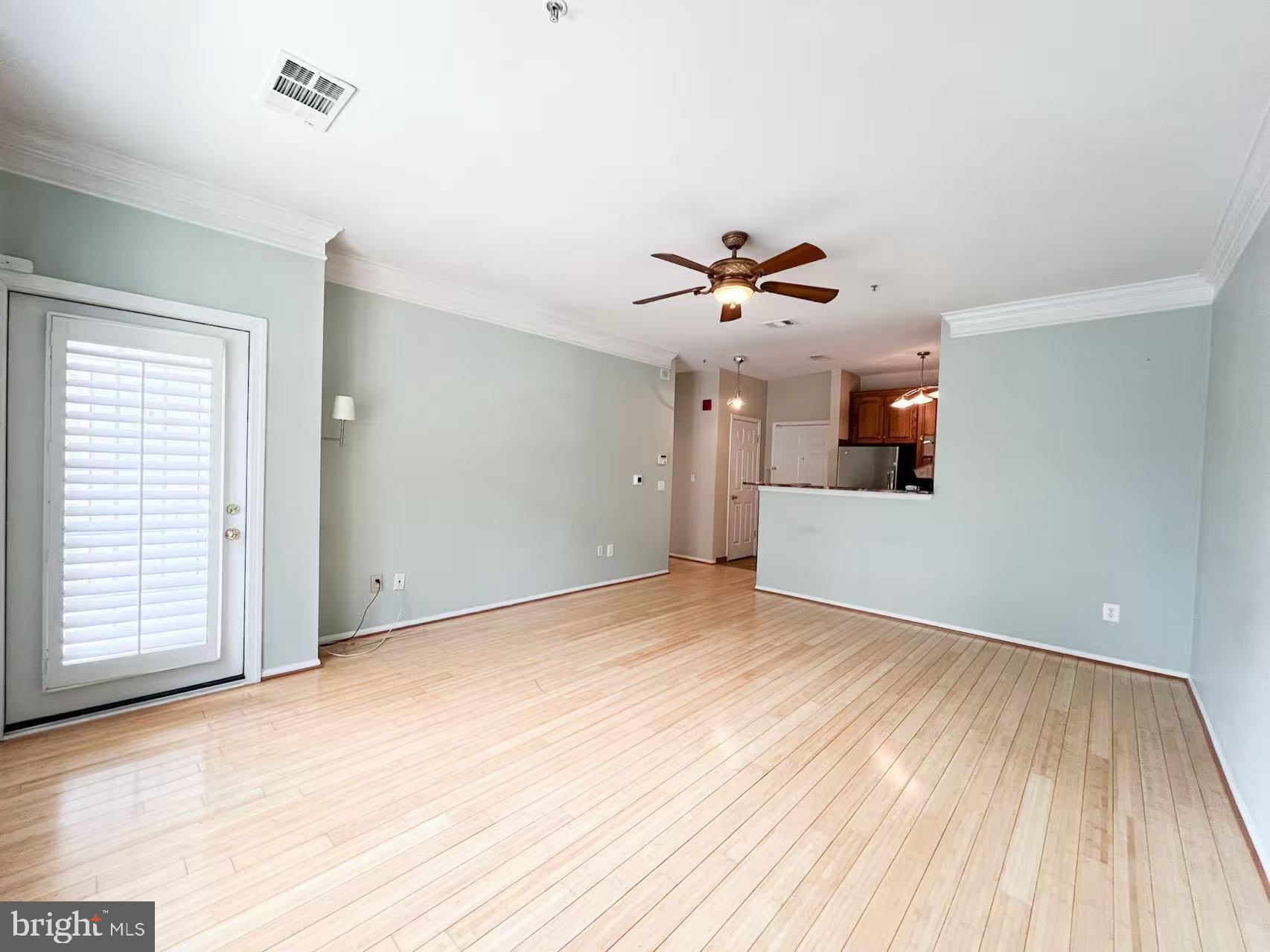 1570 Spring Gate Dr., Unit 7109 McLean, VA 22102 - Photo 14 of 21 a view of empty room with wooden floor and fan