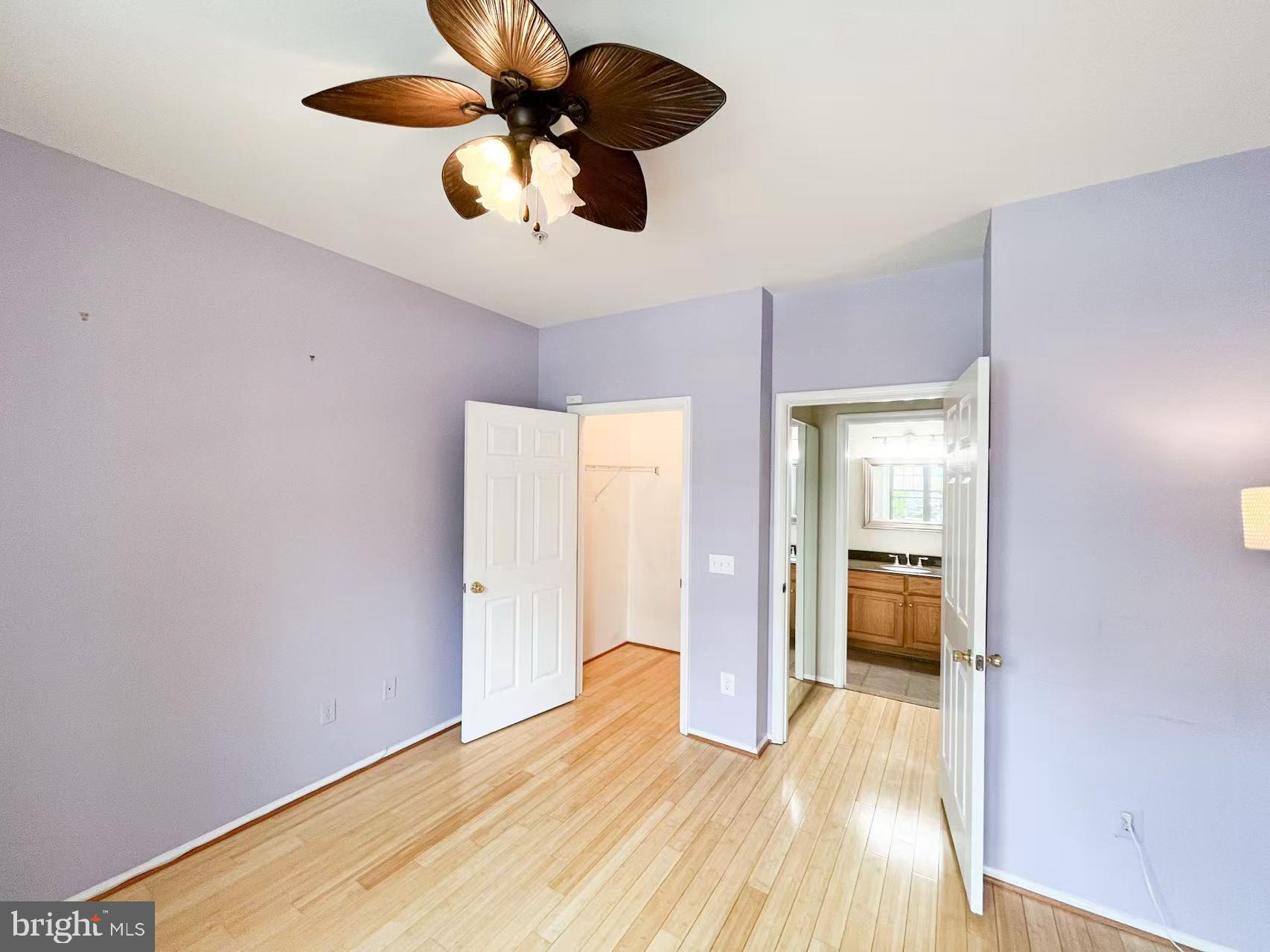 1570 Spring Gate Dr., Unit 7109 McLean, VA 22102 - Photo 15 of 21 a bedroom with a bed and a chandelier