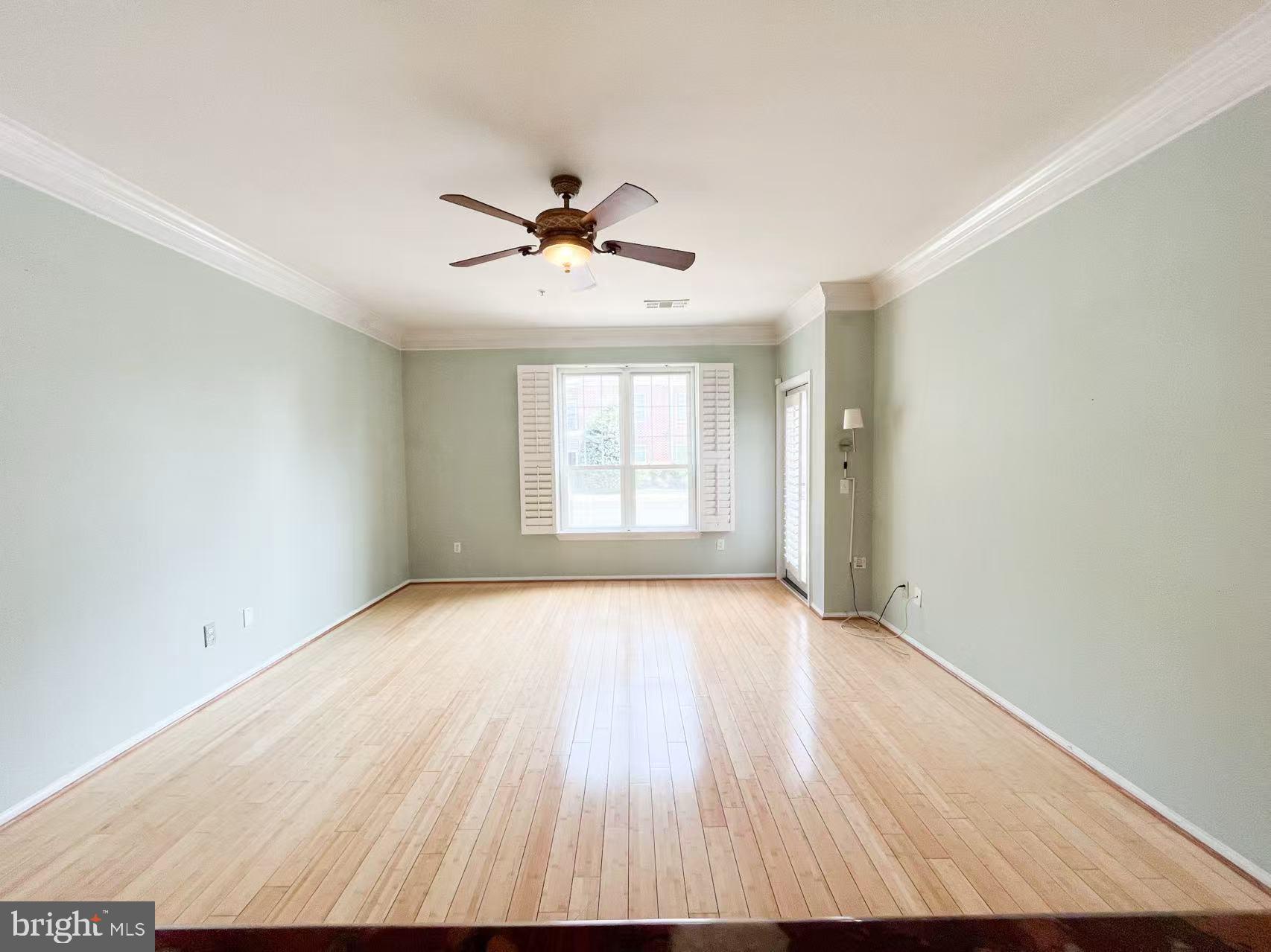 1570 Spring Gate Dr., Unit 7109 McLean, VA 22102 - Photo 8 of 21 a view of empty room with wooden floor and fan