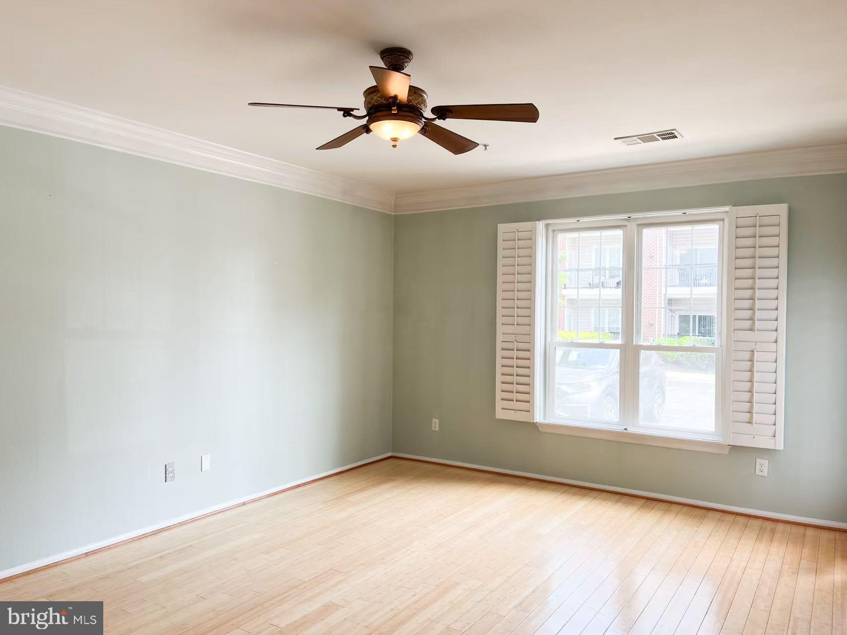 1570 Spring Gate Dr., Unit 7109 McLean, VA 22102 - Photo 10 of 21 a view of empty room with wooden floor and fan