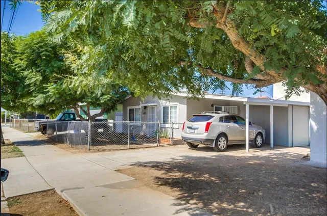a view of street with parked cars