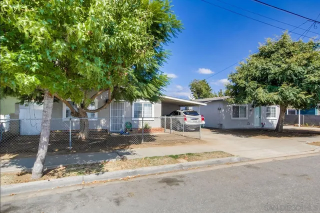 a house with a tree in front of it
