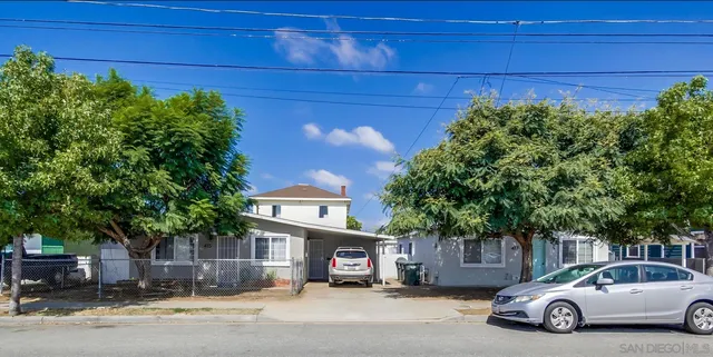 a car parked in front of a house