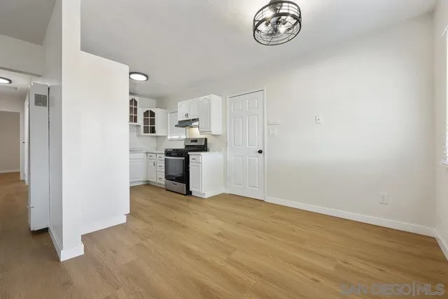 a view of a kitchen with a dishwasher cabinets and a refrigerator