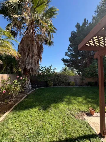 a view of a backyard of the house