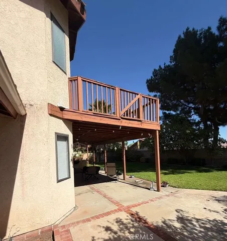 a view of a house with a yard and sitting area