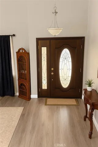 a view of a livingroom with furniture and wooden floor