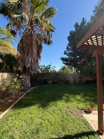 a view of a backyard of the house