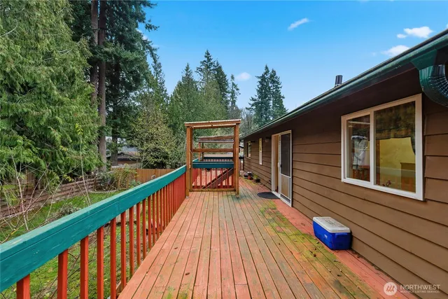 a view of balcony with deck and wooden floor