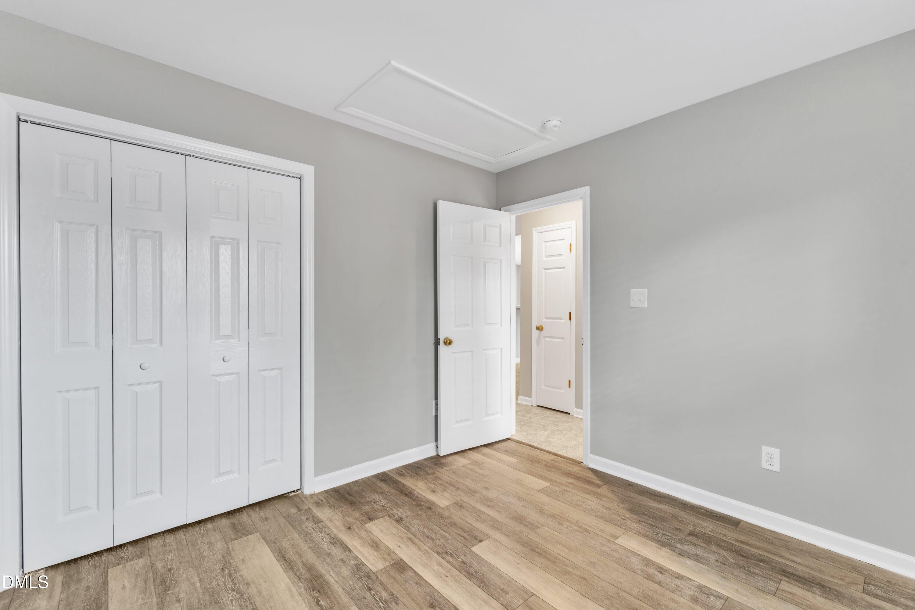 4917 Silverdene Street Raleigh, NC 27616 - Photo 23 of 35 a view of an empty room and wooden floor