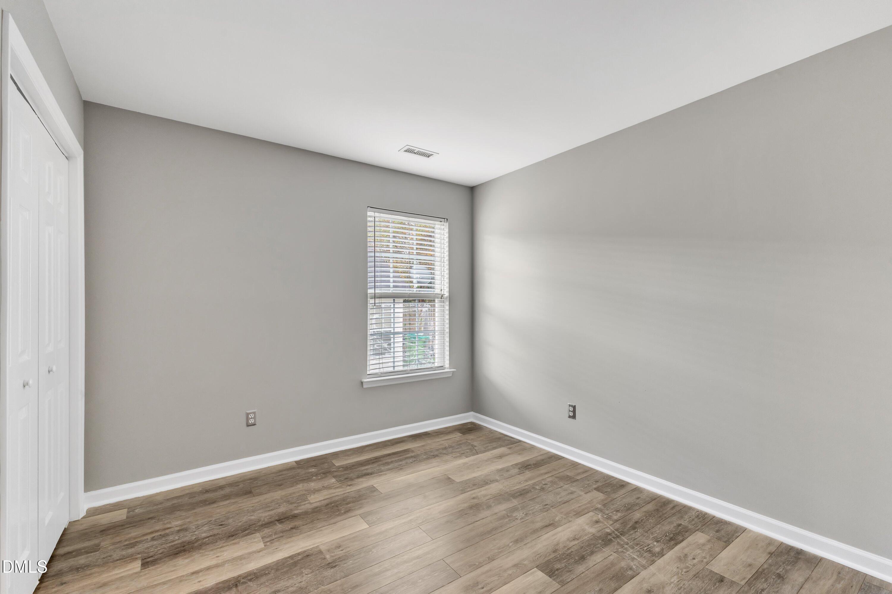 4917 Silverdene Street Raleigh, NC 27616 - Photo 26 of 35 a view of empty room with wooden floor