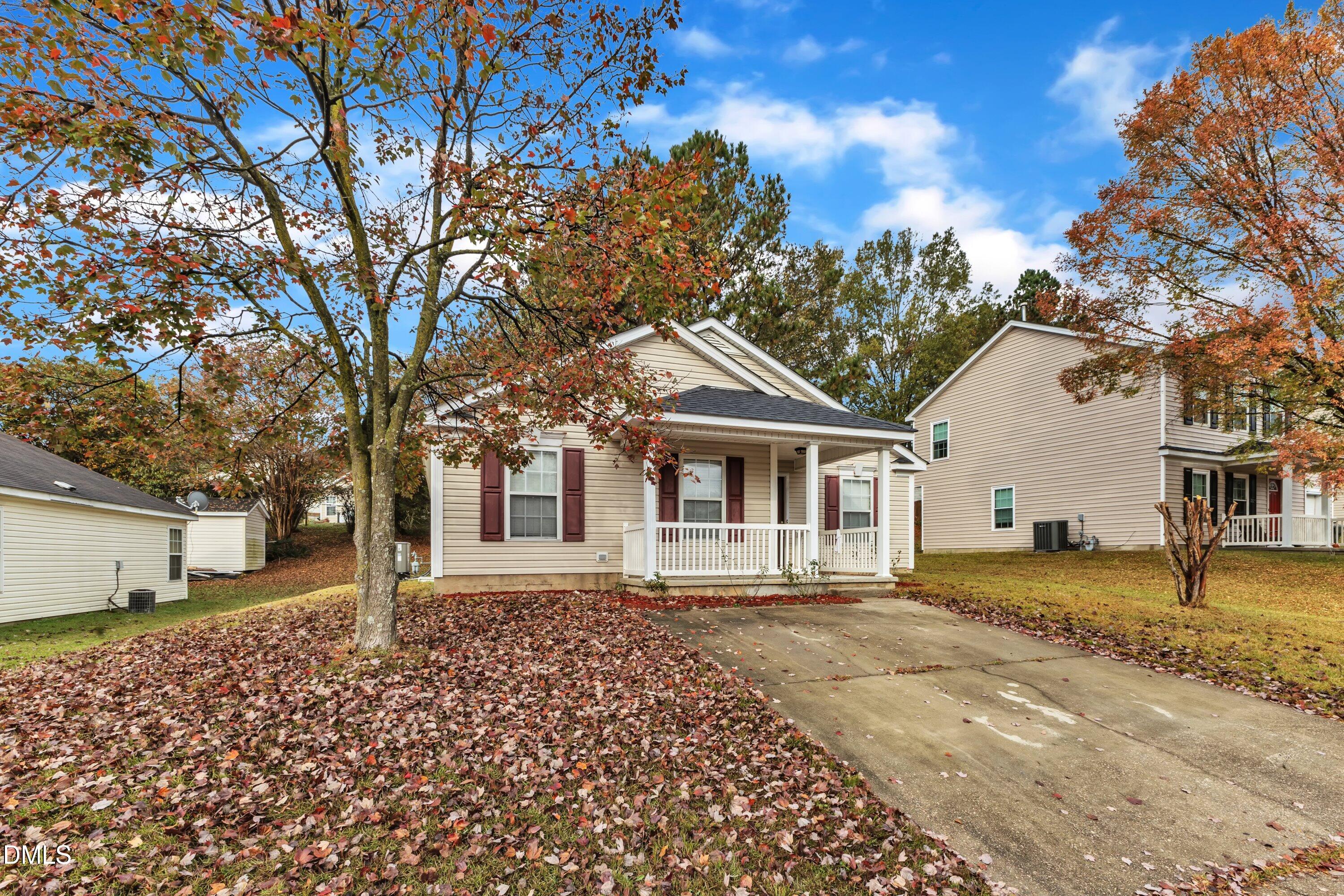 4917 Silverdene Street Raleigh, NC 27616 - Photo 4 of 35 a front view of a house with a garden