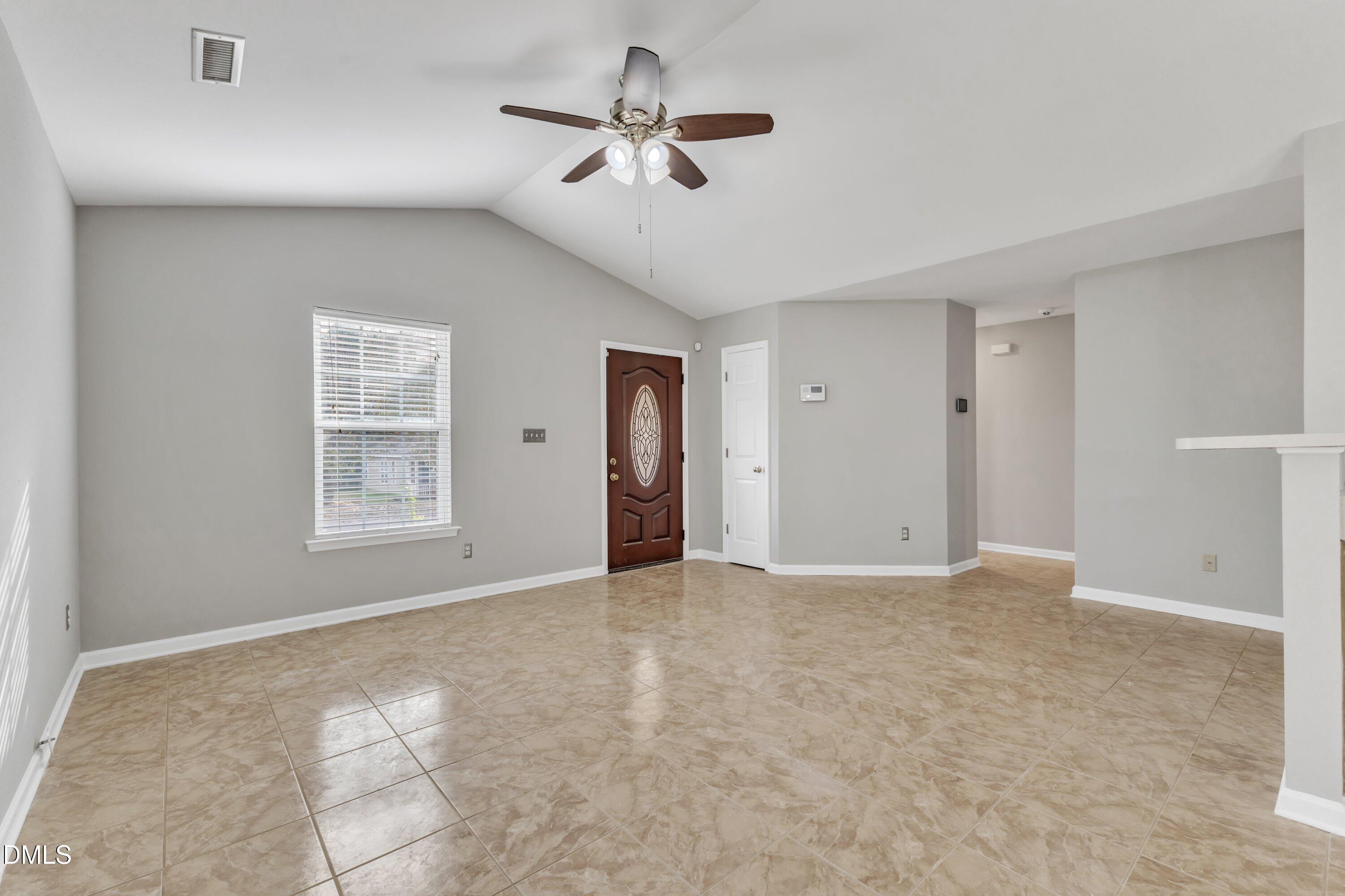 4917 Silverdene Street Raleigh, NC 27616 - Photo 8 of 35 a view of an empty room with a ceiling fan