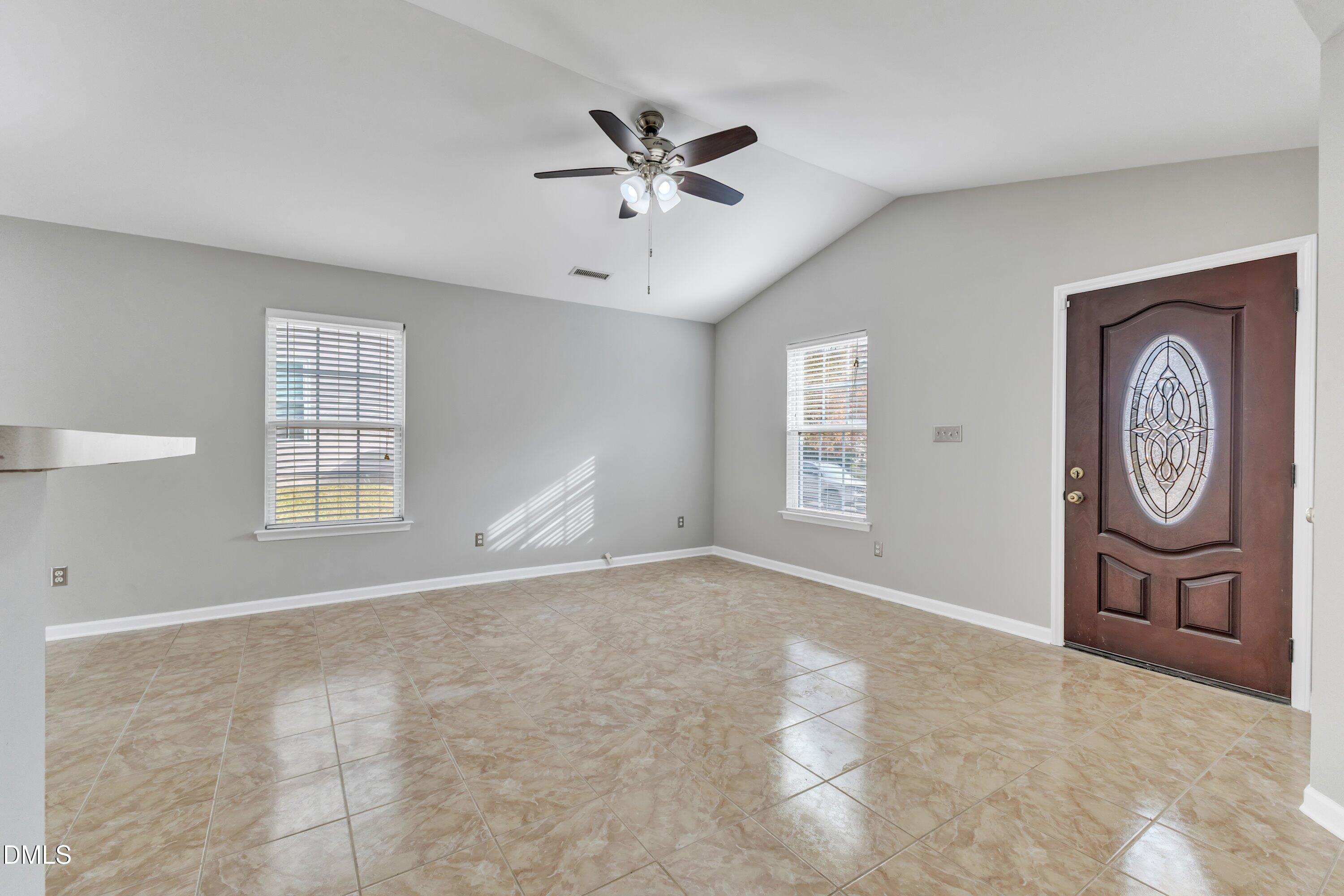 4917 Silverdene Street Raleigh, NC 27616 - Photo 9 of 35 a view of an empty room with a window
