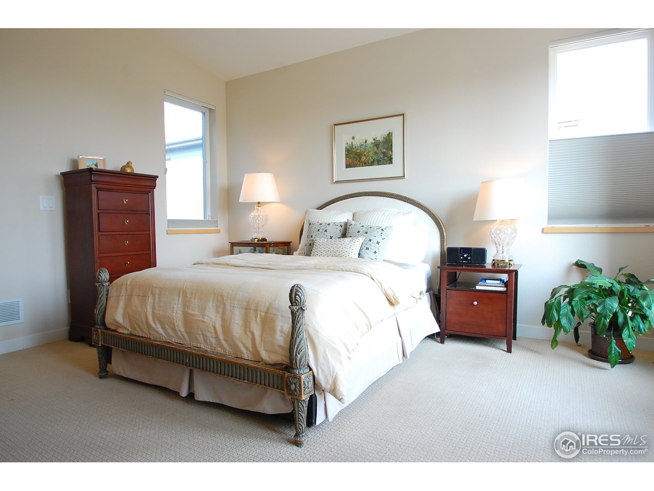 5247 5th Street Boulder, CO 80304 - Photo 14 of 22 a bed room with a bed and a potted plant