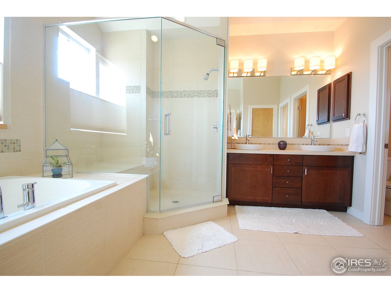 5247 5th Street Boulder, CO 80304 - Photo 15 of 22 a bathroom with a bathtub sink and mirror