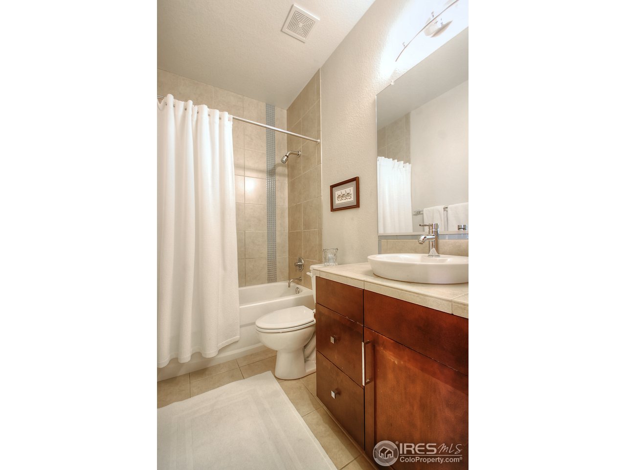 5247 5th Street Boulder, CO 80304 - Photo 18 of 22 a bathroom with a sink a toilet and shower