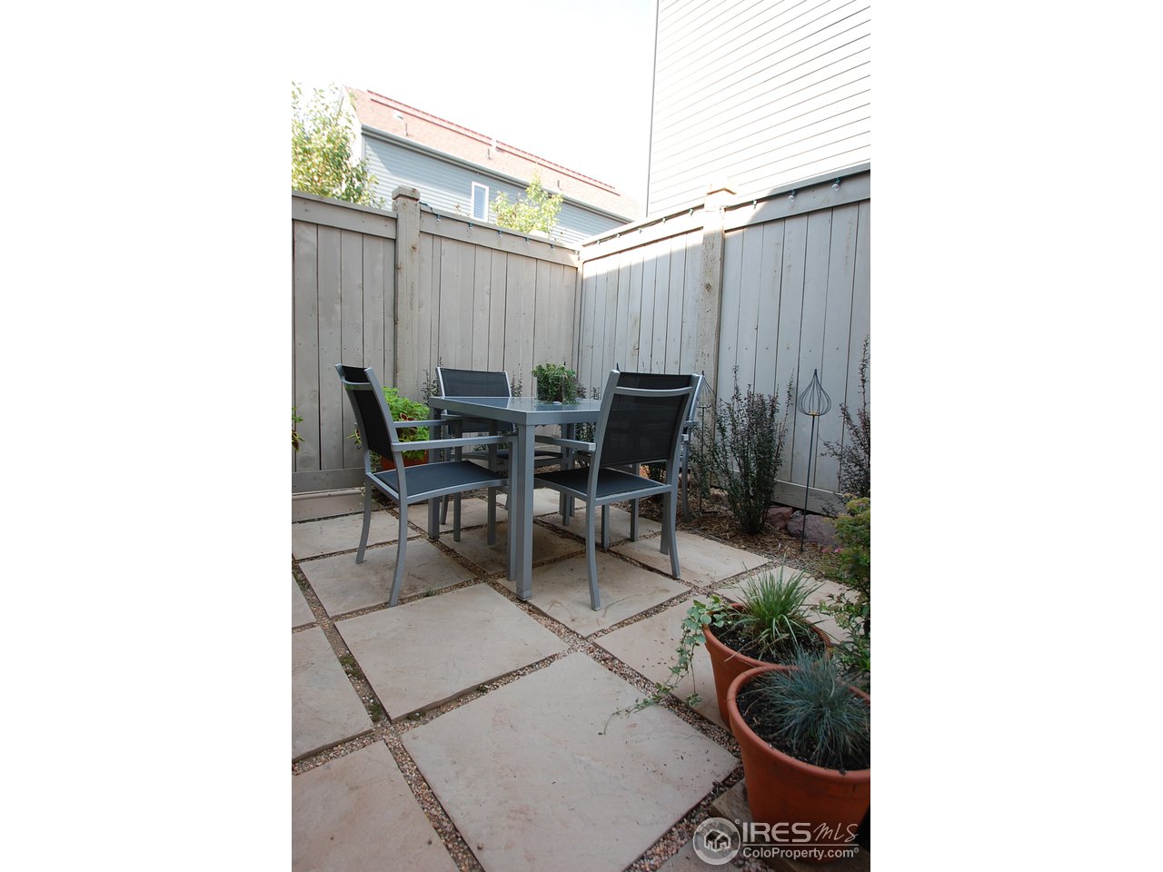 5247 5th Street Boulder, CO 80304 - Photo 20 of 22 a backyard of a house with outdoor seating