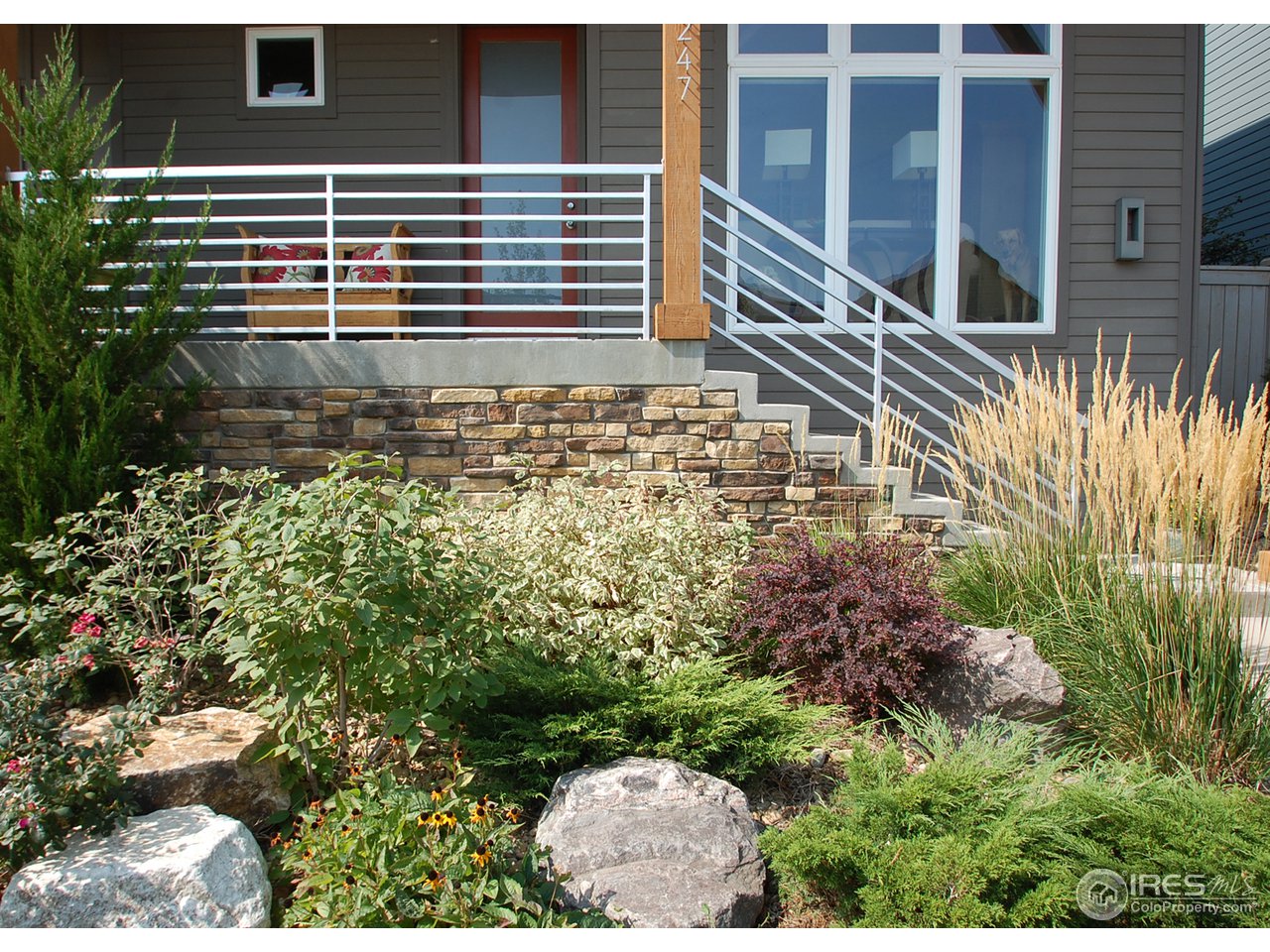 5247 5th Street Boulder, CO 80304 - Photo 2 of 22 a view of a balcony with a plants and large windows