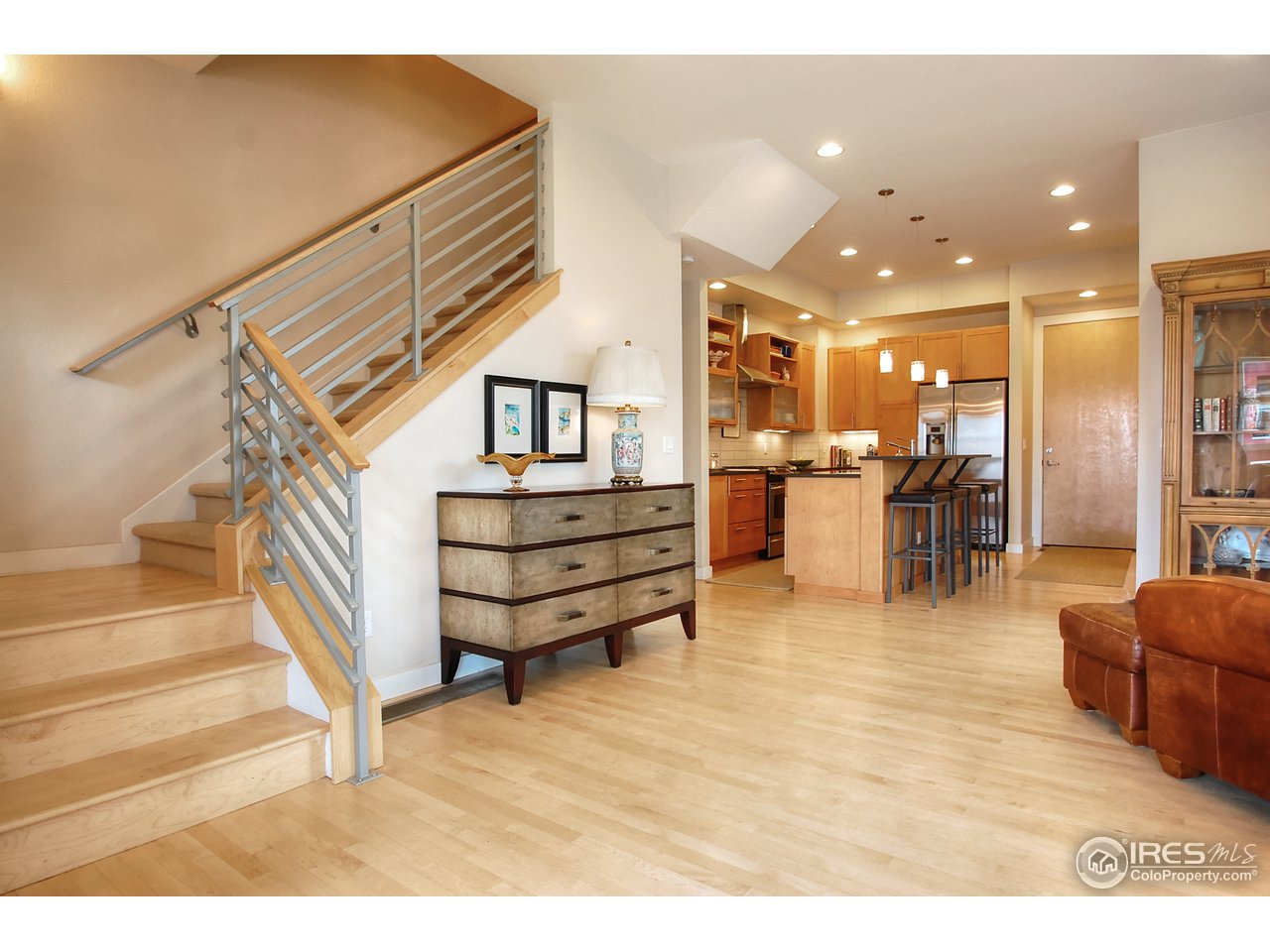 5247 5th Street Boulder, CO 80304 - Photo 5 of 22 a living room with couches and kitchen view with wooden floor