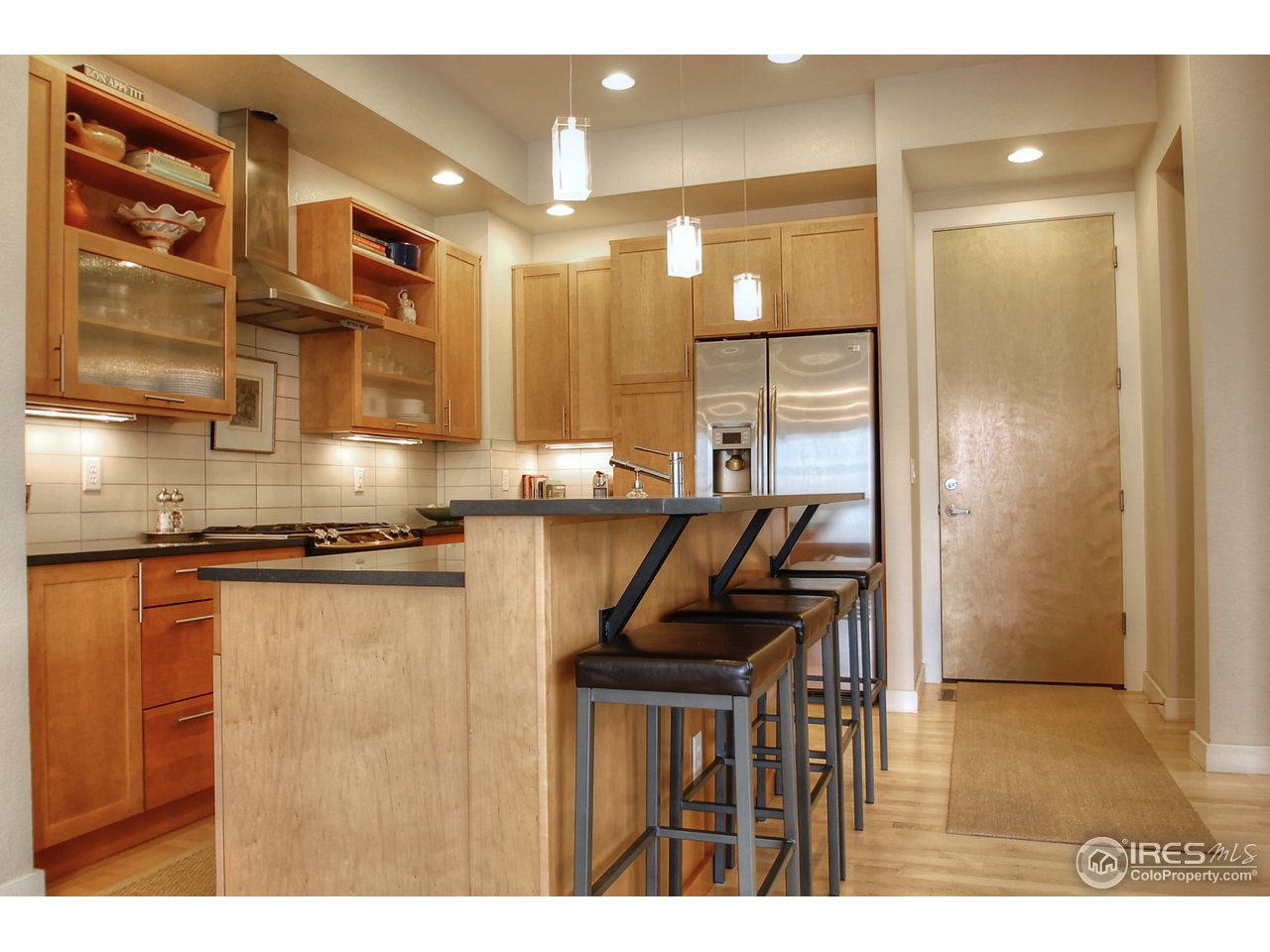 5247 5th Street Boulder, CO 80304 - Photo 8 of 22 a kitchen with stainless steel appliances granite countertop a sink and cabinets