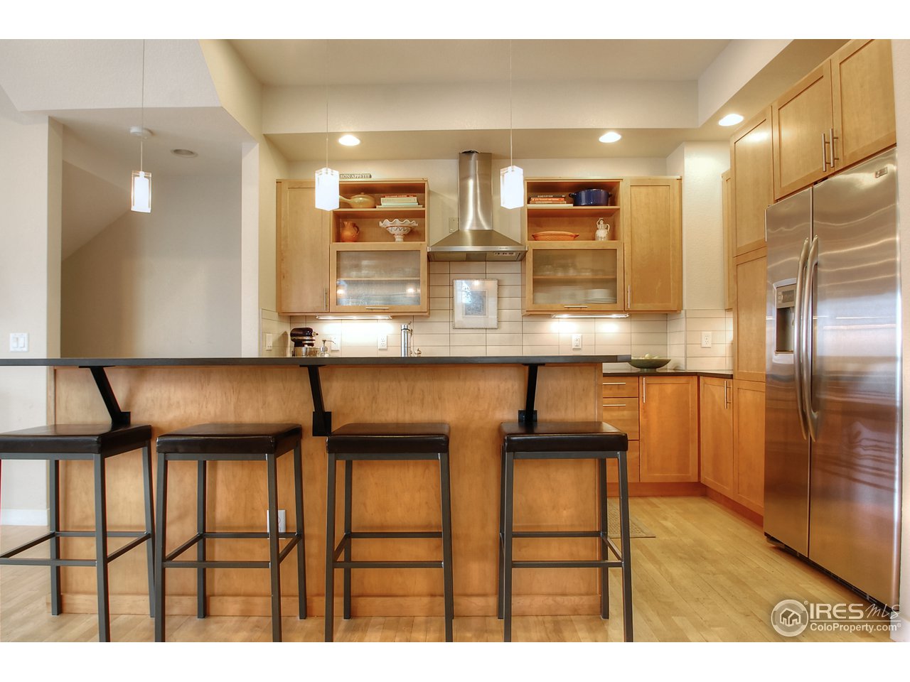 5247 5th Street Boulder, CO 80304 - Photo 10 of 22 a kitchen with granite countertop cabinets and stainless steel appliances