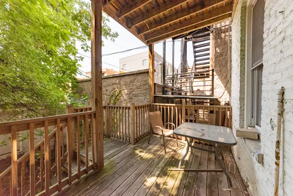 a view of balcony with wooden floor