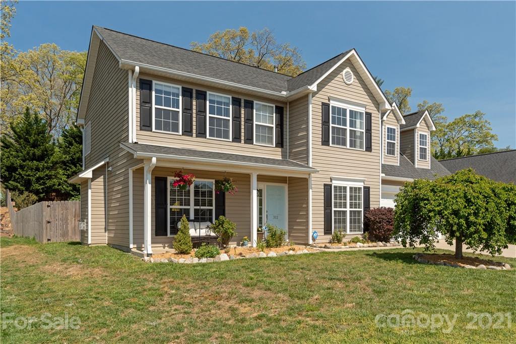 312 Black River Road Fletcher, NC 28732 - Photo 1 of 29 a front view of a house with garden