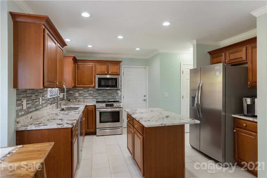 312 Black River Road Fletcher, NC 28732 - Photo 13 of 29 a kitchen with stainless steel appliances granite countertop refrigerator sink and stove