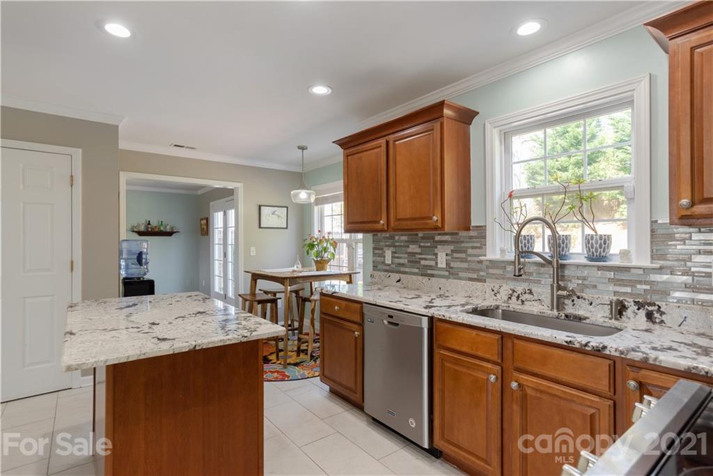 312 Black River Road Fletcher, NC 28732 - Photo 15 of 29 a kitchen with stainless steel appliances granite countertop sink stove and refrigerator