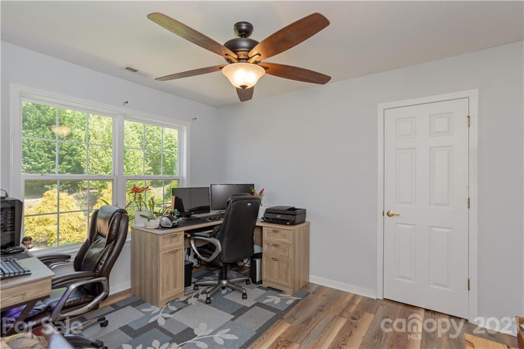 312 Black River Road Fletcher, NC 28732 - Photo 21 of 29 a view of a workspace with furniture and a window