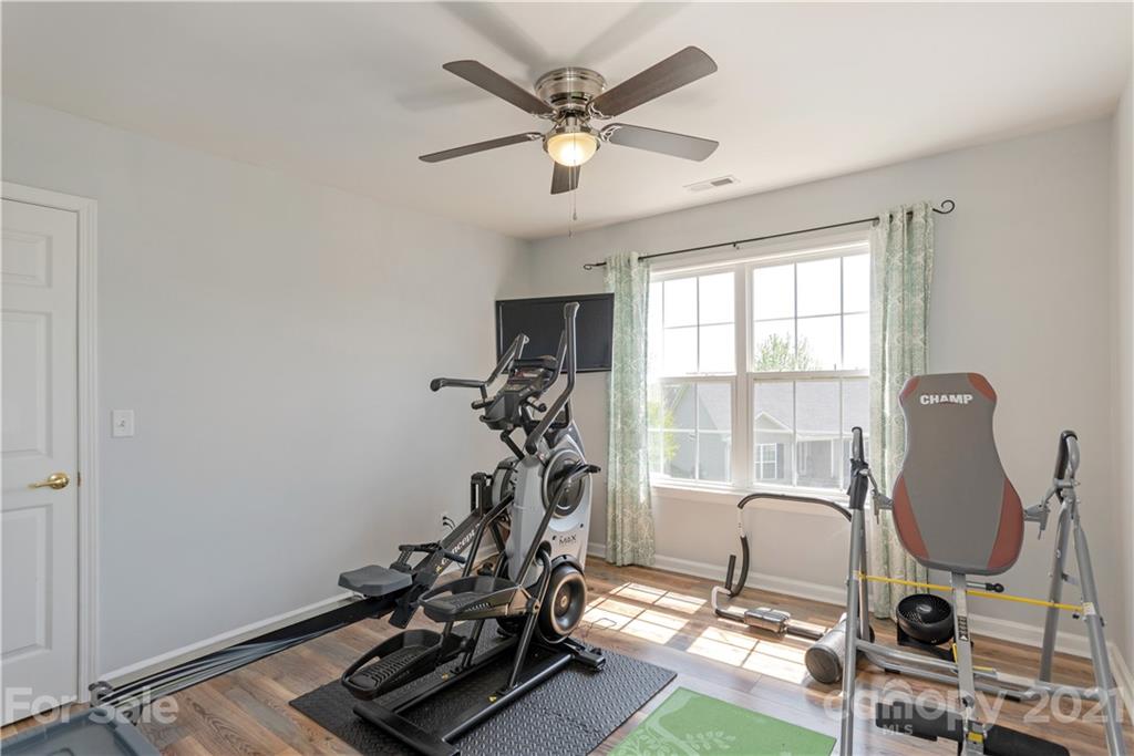 312 Black River Road Fletcher, NC 28732 - Photo 23 of 29 a room with gym equipment and windows