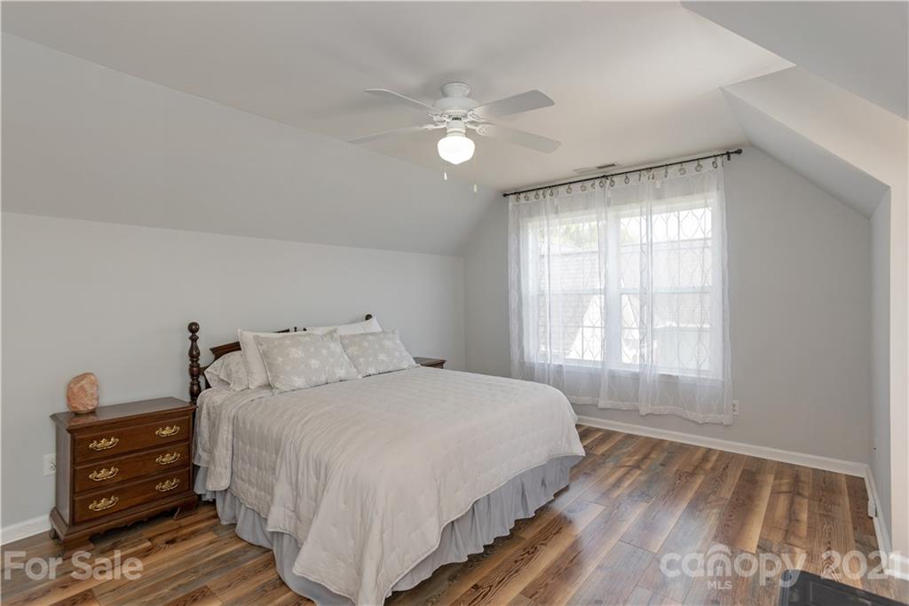 312 Black River Road Fletcher, NC 28732 - Photo 24 of 29 a bedroom with a bed and a dresser