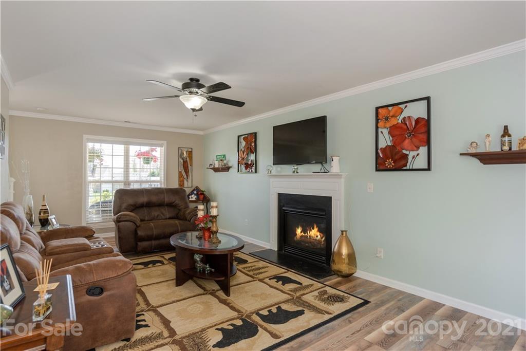 312 Black River Road Fletcher, NC 28732 - Photo 4 of 29 a living room with furniture a flat screen tv and a fireplace