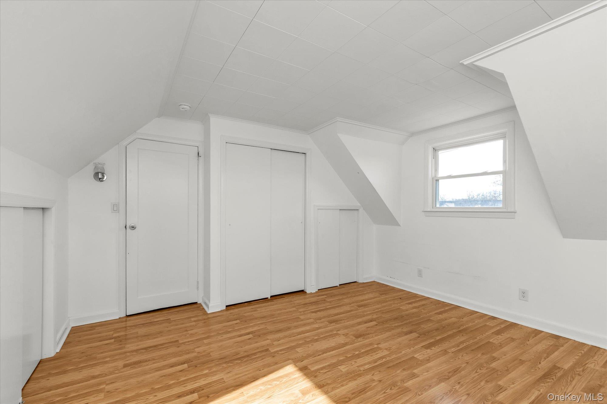 5 White Street Valley Stream, NY 11580 - Photo 15 of 23 a view of empty room with wooden floor and fan