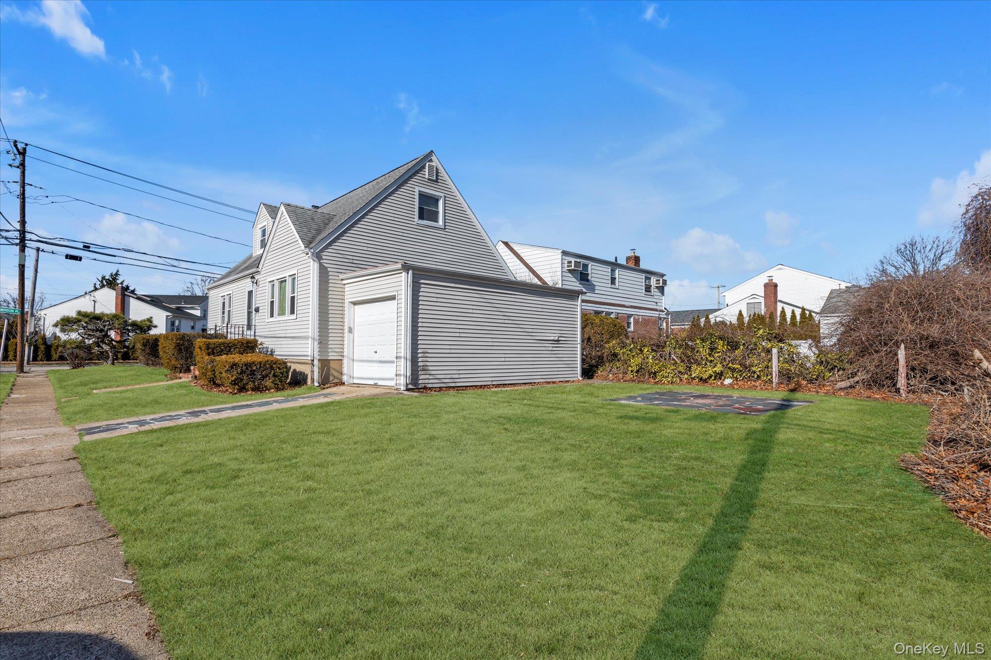 5 White Street Valley Stream, NY 11580 - Photo 21 of 23 a front view of a house with garden