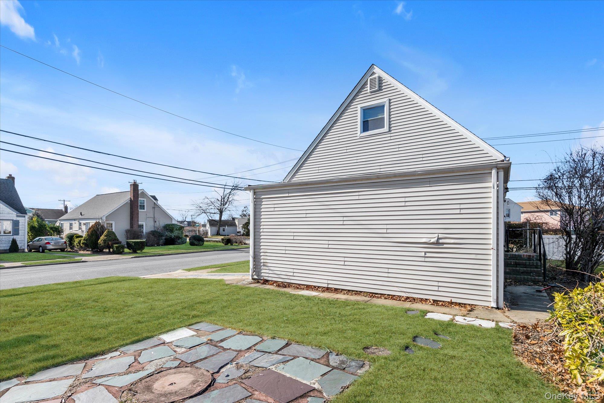 5 White Street Valley Stream, NY 11580 - Photo 22 of 23 a front view of a house with a yard