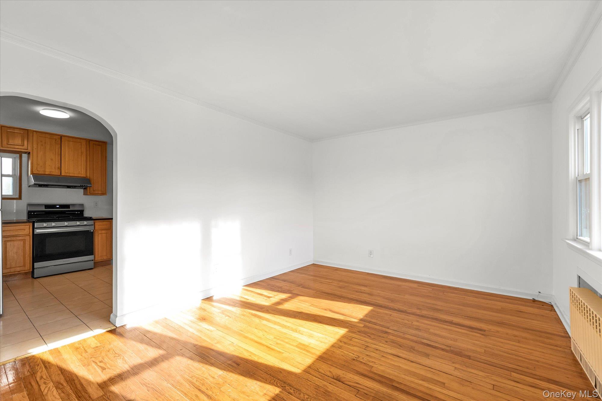 5 White Street Valley Stream, NY 11580 - Photo 4 of 23 a bedroom with a bed and a stove