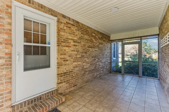 a view of empty room with windows