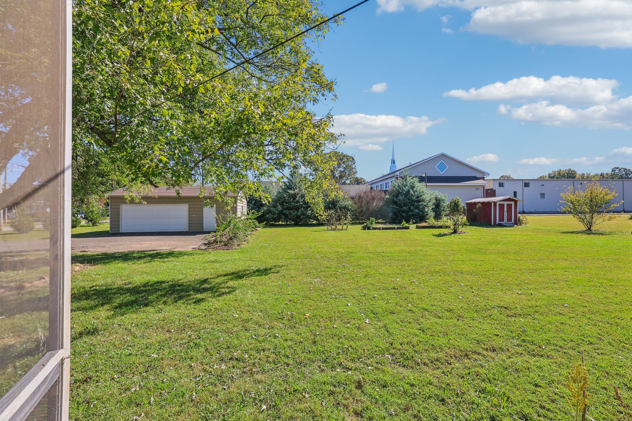 404 8th Avenue North Decherd, TN 37324 - Photo 22 of 23 a front view of a house with garden