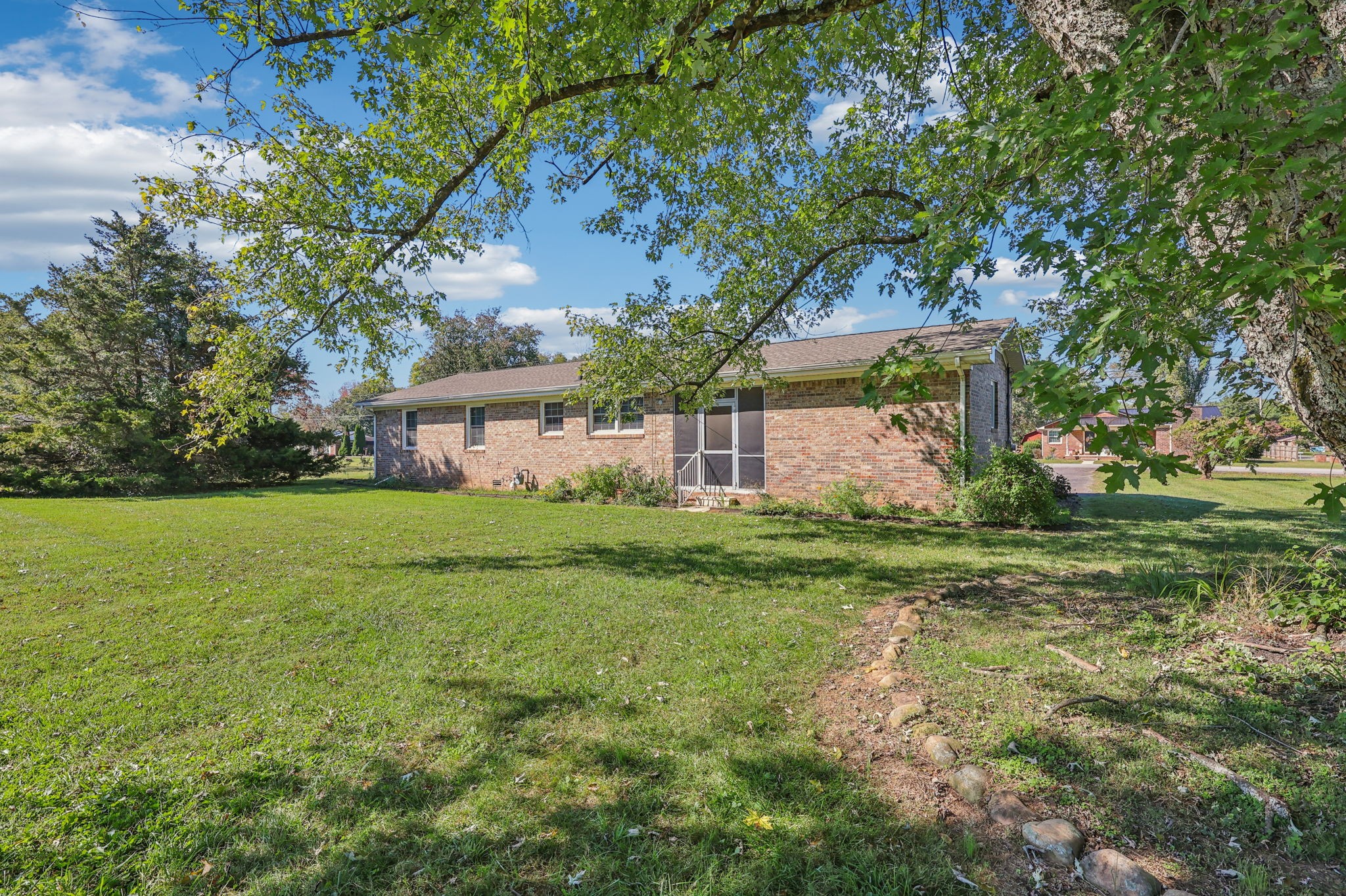404 8th Avenue North Decherd, TN 37324 - Photo 23 of 23 a front view of house with yard and trees