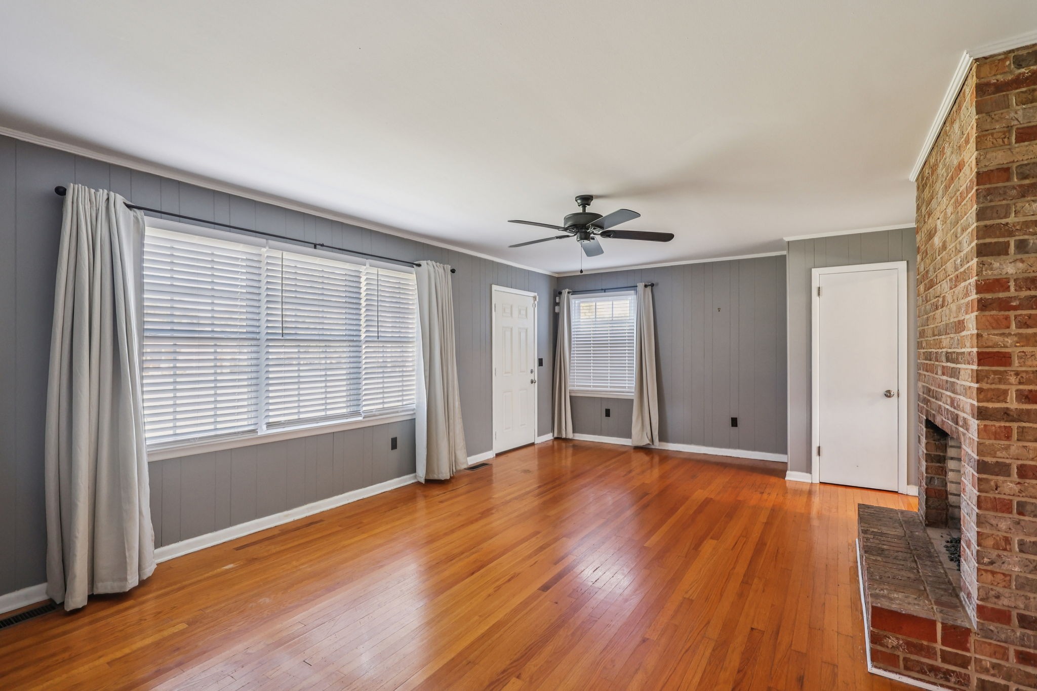 404 8th Avenue North Decherd, TN 37324 - Photo 4 of 23 a view of an empty room with wooden floor and a window