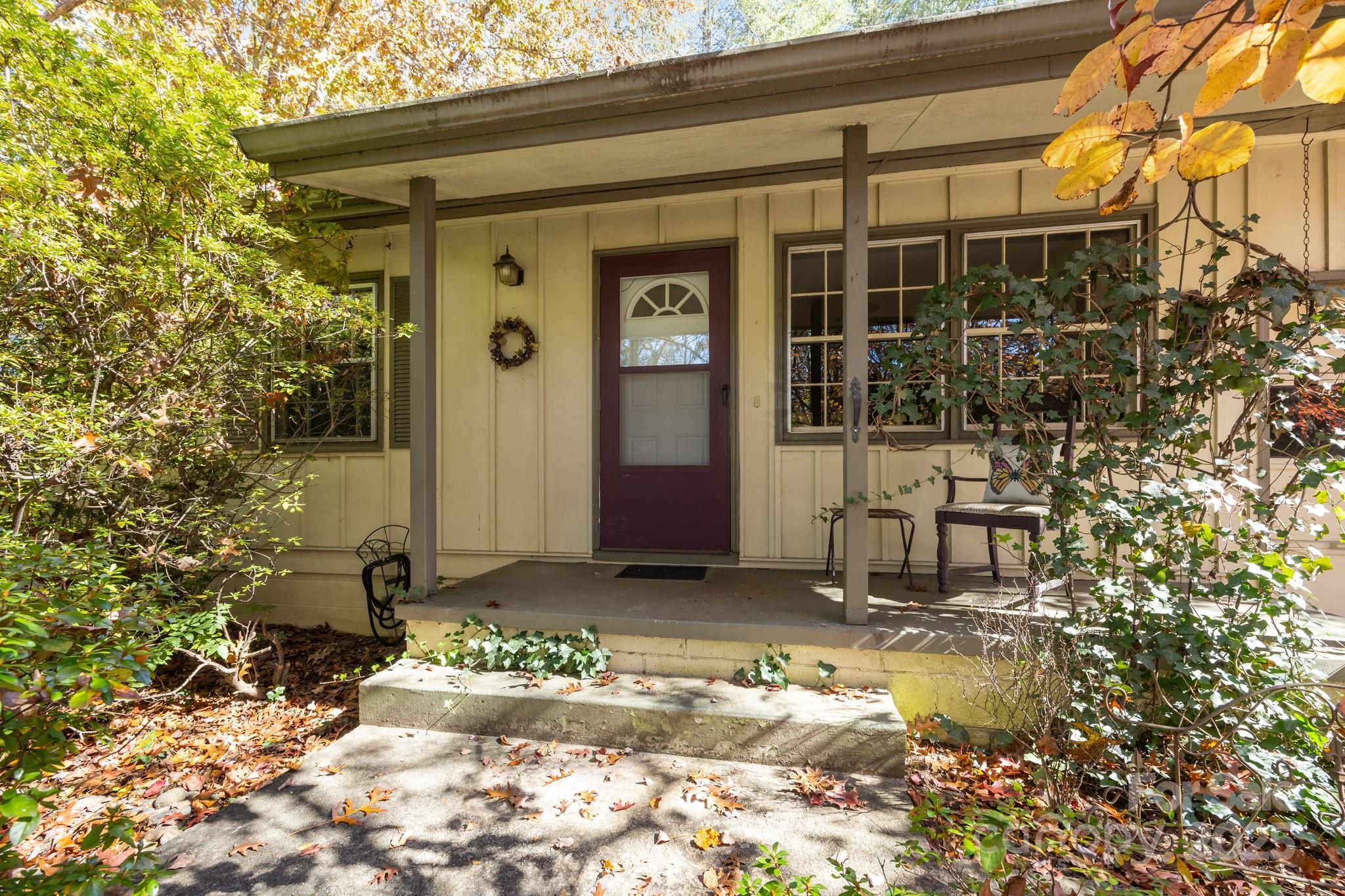 3228 Sweeten Creek Road Asheville, NC 28803 - Photo 1 of 48 a front view of a house with a yard