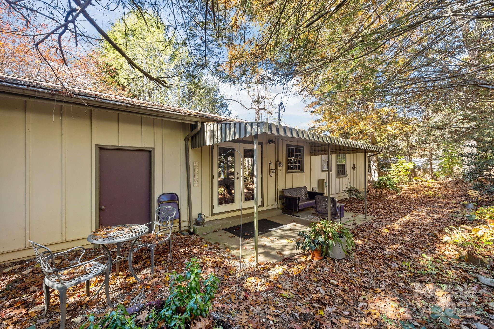 3228 Sweeten Creek Road Asheville, NC 28803 - Photo 12 of 48 a front view of a house with garden