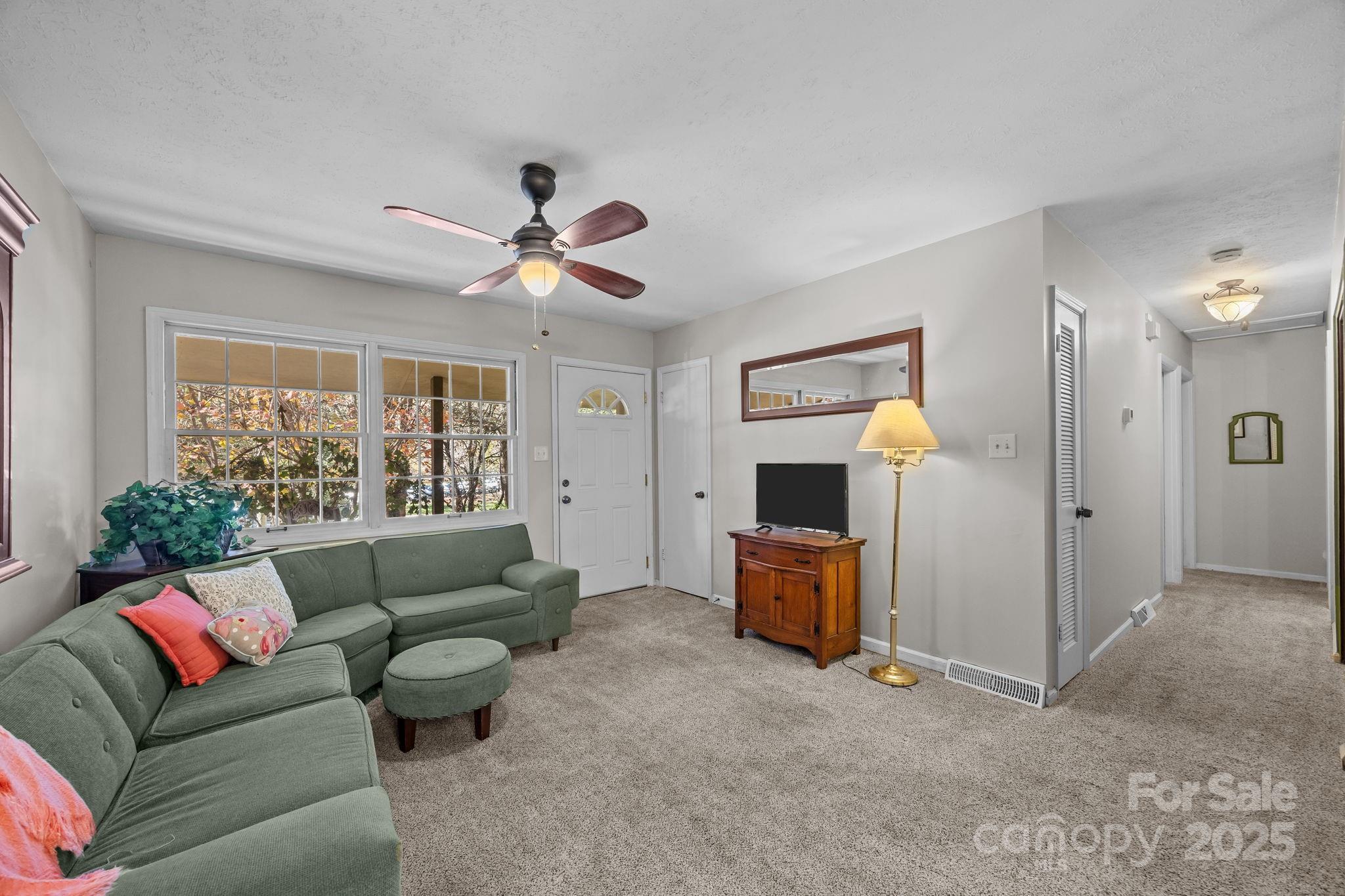 3228 Sweeten Creek Road Asheville, NC 28803 - Photo 23 of 48 a living room with furniture and a large window